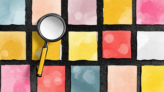 Kachelfelder Mehrere Bunte Kacheln mit einem schwarzen Gitter, worüber eine Lupe liegt.