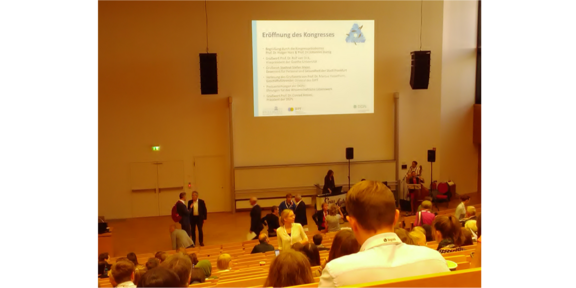 Lecture hall with view of presentation on the wall.